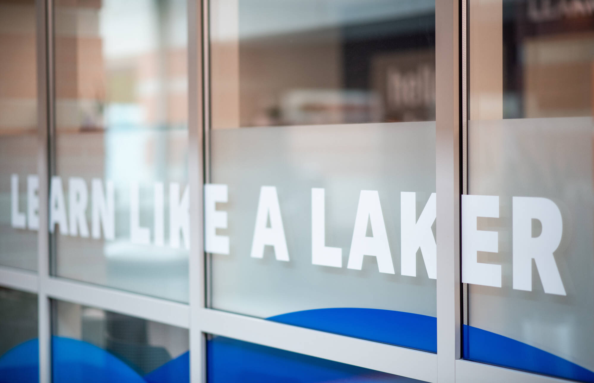 "LEARN LIKE A LAKER" tag on a wall in the Tutoring and Reading Center